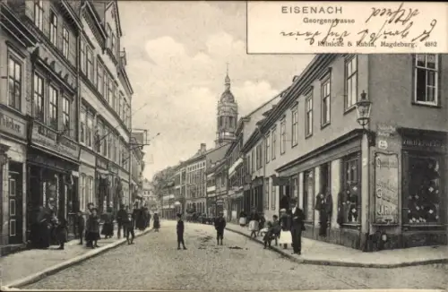 Ak Lutherstadt Eisenach in Thüringen, Blick in die Georgenstraße, Geschäft J. Reiss, Wilh. Schütz