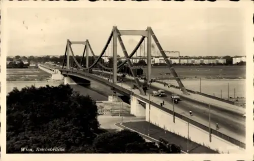 Ak Wien 22 Donaustadt, Reichsbrücke in  Autos, Fluss, Stadtansicht