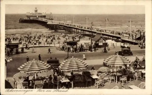 Ak Scheveningen Den Haag Südholland, Strandpromenade, Menschenmengen, Sonnenschirme, Autos, Pier