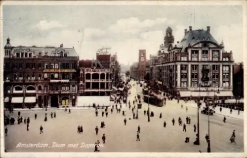 Ak Amsterdam Nordholland Niederlande,  Dam mit Dami, Menschenmenge, Straßenbahn, Geschäfte
