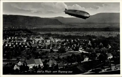 Ak Weil am Rhein, Luftaufnahme von  Zeppelin, Häuser, Landschaft