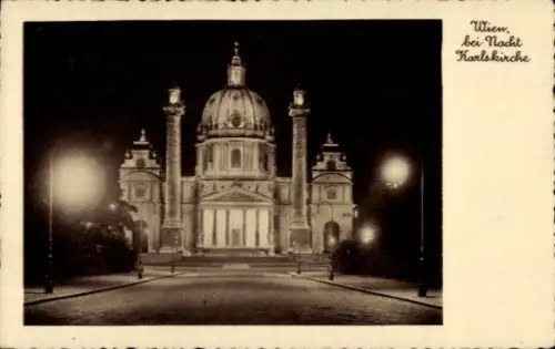 Ak Wien 1 Innere Stadt,  Karlskirche bei Nacht, Straßenlaternen, keine Persönlichkeiten