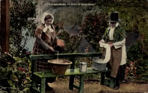 Ak Wales, Walisische Frauen in Tracht beim Waschen