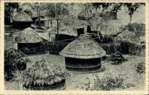 Ak Rhodesien Simbabwe, Un kraal, Strohhütten