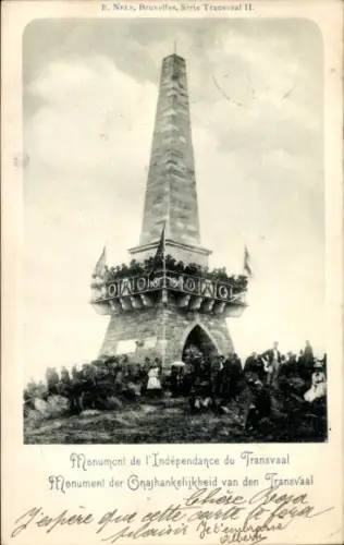 Ak Transvaal Südafrika, hoher Obelisk, Sockel mit Bogen, umlaufender Balkon mit Girlanden, Mensch