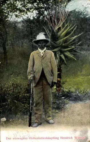Ak Namibia, Der verwegene Hottentottenhäuptling Hendrick Wittboi mit Gewehr vor einer Agave