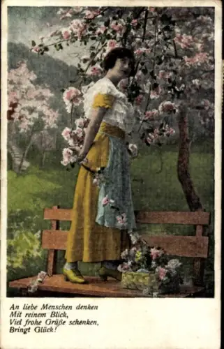 Ak Junge Frau pflückt Blumen, Blühender Baum, Blumenkorb