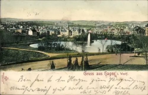Ak Hagen in Westfalen, See mit Springbrunnen, Parkwege, Rasenflächen, Bäume, Kirchturm, Wohnhäuse