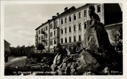 Ak Klagenfurt am Wörthersee Kärnten, Artillerie-Denkmal, Felsenblock mit Löwe, Kanonenrad, Gedenk