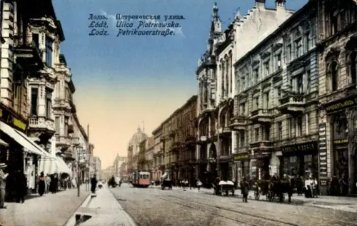 Ak Łódź Lodz Lodsch Polen, Straße mit Tram, Geschäfte, Menschen, mehrsprachiger Text