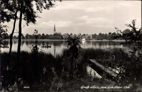 Ak Groß Köris, am Schulzensee, Steg, Ruderboot, Kirchturm