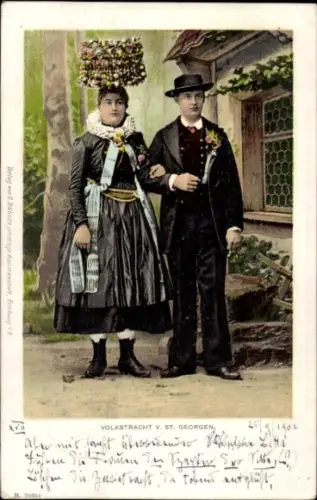 Ak St. Georgen Schwarzwald, Blick auf Paar in Tracht