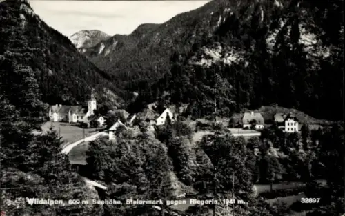 Ak Wildalpen Steiermark, Dorf im Tal, Kirche mit Turm, Häuser, geschwungene Straße, Bäume, Berge