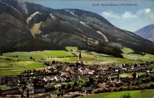 Ak Rottenmann Steiermark, Bergmassiv im Hintergrund, grüne Felder, Dorf im Tal, markanter Kirchtu