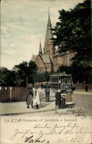 Ak Kiel, Knooperweg mit Jacobikirche, Damenstift, Straßenbahn