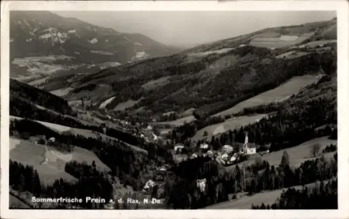 Ak Prein Reichenau an der Rax Niederösterreich, Bergtal mit Dorf, Kirchturm, verstreute Häuser, W
