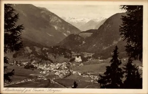 Ak Mauterndorf in Salzburg, Dorf im Bergtal, markanter Turm, Häuser und Wiesen, Nadelbäume, schne