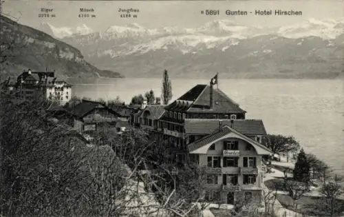 Ak Gunten am Thunersee Kanton Bern, Hotel Hirschen, Eiger, Mönch, Jungfrau