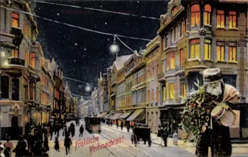 Ak Düsseldorf am Rhein, Straßenpartie im Winter, Fröhliche Weihnachten