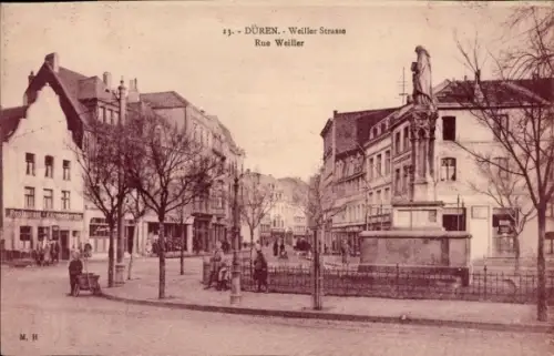Ak Düren im Rheinland,  Weiller Strasse (Rue Weiller), Denkmal/Brunnen