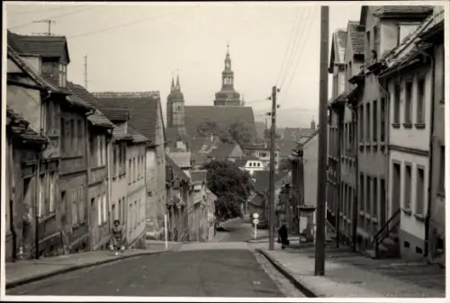 Foto Ak Lutherstadt Eisleben, Straßenpartie, Kirche