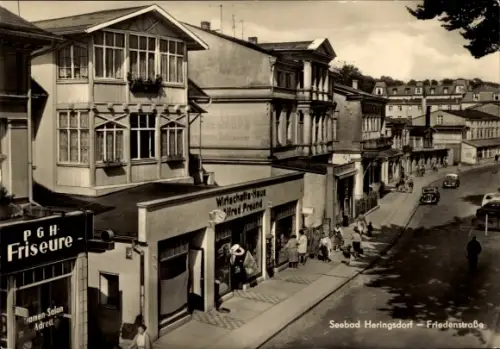 Ak Ostseebad Heringsdorf auf Usedom, Friedenstraße, PGH Friseure, Wirtschafts-Haus Alfred Freund