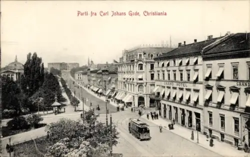 Ak Christiania Oslo Norwegen, Straßenpartie, Carl Johans Gade, Straßenbahn, Grand Hotel