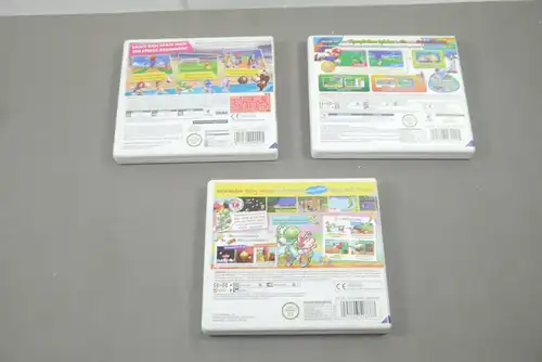 Nintendo 3DS 3 x  Hüllen mit Spielanleitung 2x  Mario 1x Yoshi ohne Spiel (K43)