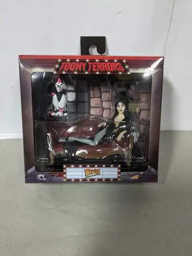 Neca Toony Terrors Elvira, Mistress of the Dark  Figur Elvira on Couch 15 cm 1F