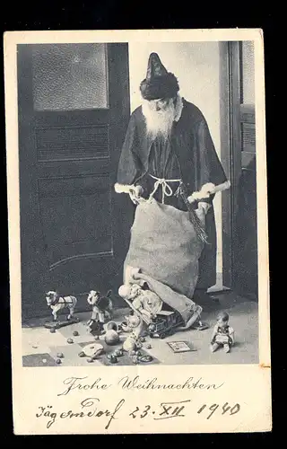 Photo AK Noël: Père Noël jette sac avec des jouets, JÄGERNDORF