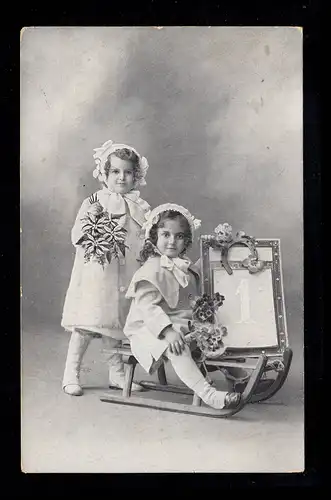 AK photo Nouvel An: Deux filles avec traîneau feuille calendrier 1er Janvier HAARLEM 1916