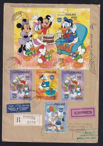 Donald Duck auf  R-Ausland-Brief von Togo nach Deutschland gelaufen mit Ak-St.