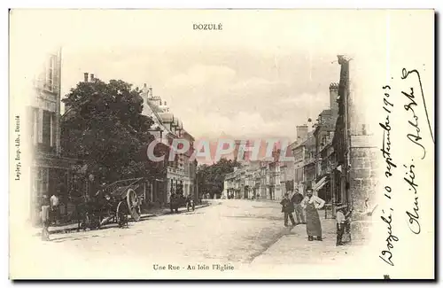 Cartes postales Dozule Une Rue Au loin l Eglise