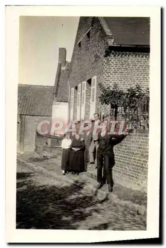 Photo Famille devant sa maison