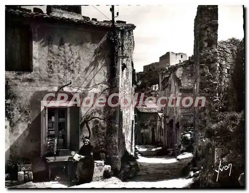 Cartes postales moderne Les Baux de Provence B du R Rue du Trincot au fond Ruines du Chateau feodal