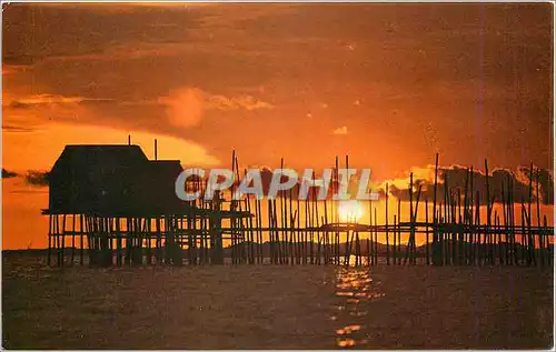 Moderne Karte A village kelong or fish trap set in the Singapore Strais near Singapore Qantas