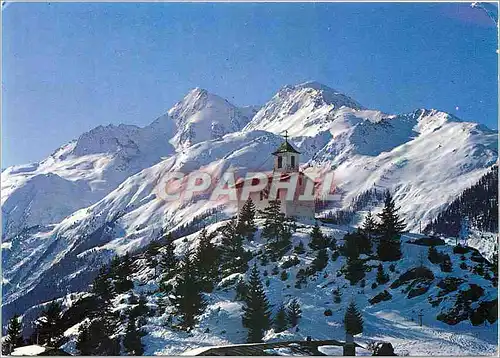 Cartes postales moderne Montvalezan la Rosiere (Savoie) alt 1850 m La Chapelle du Chatelard au fond le Mont Pourri (alt