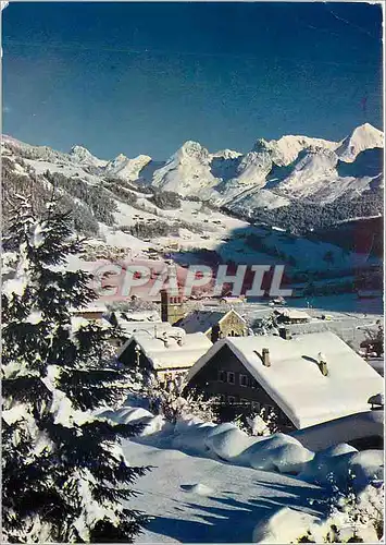 Moderne Karte Le Grand Bornand Haute Savoie Feerie hivernale sur la station avec au fond la chaine des Aravis