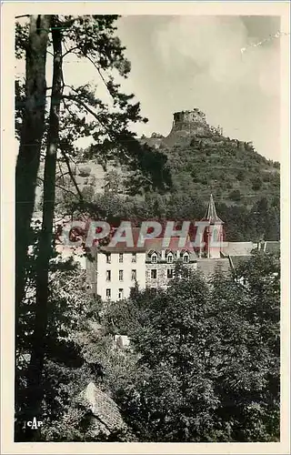 Cartes postales moderne Murols Le Chateau et l'Eglise Vus a Travers Les Pins