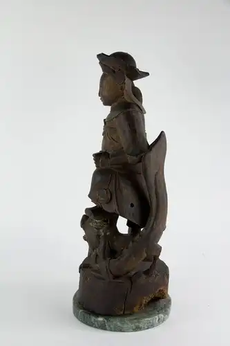Figur, China, wohl Ming Dynastie (1368 bis 1644), Holz, geschnitzt, Tempelfigur, Wächter, auf Löwen und Drachen stehend, ursprünglich farblich gefasst und bemalt, schöne Ausarbeitung, Fehlstellen, auf modernen Steinsockel montiert. H: 43,5 cm
