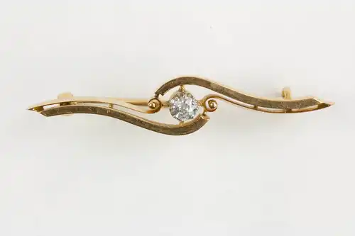 Brosche, 1. Hälfte 20. Jh., 18 Karat Gold, mit Brillanten (ca. 0,2 ct) besetzt.  L: 45 mm