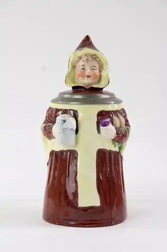 Bierkrug, Ende 19. Jh., ungemarkt, Porzellan, plastisch in Form eines Münchner Kindls ausgearbeitet, unbeschädigt, Gebrauchsspuren, H: 20,5 cm.