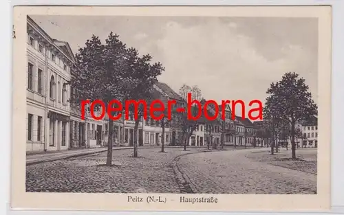 82287 Ak Peitz N.-L. (Picnjo) Rue principale avec magasins 1928