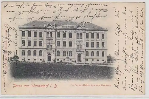 69698 Ak Gruß aus Warnsdorf in Böhmen Bezirk-Volksschule mit Denkmal 1908