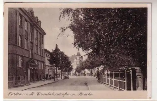 55273 Ak Güstrow in Meckl. Eisenbahnstraße mit Brücke um 1940