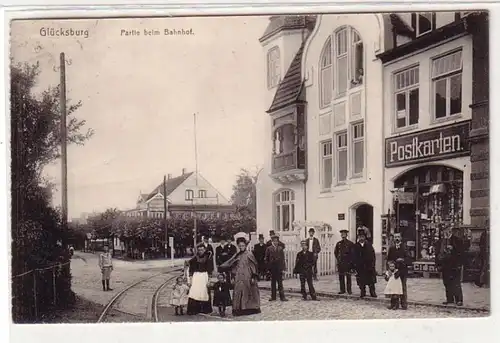 53413 Ak Glücksburg Partie beim Bahnhof mit Postkartengeschäft 1917