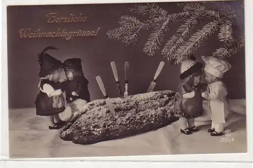 52796 Weihnachts Ak Puppen schneiden einen Stollen an um 1920