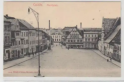 34616 Ak Colditz Marktplatz mit Geschäften um 1910