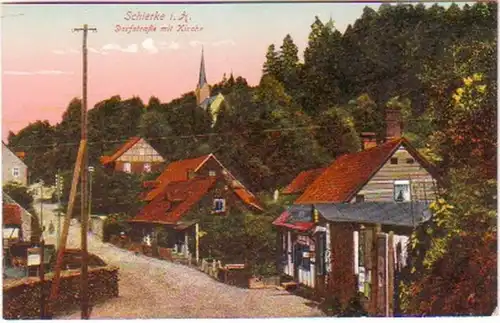 19639 Ak Schierke i. Harz Dorfstraße mit Kirche um 1920
