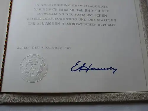 DDR acte de l'ordre du Mérite Père Argent 1987 Joachim Rähmer (103488)